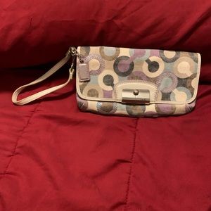 Small white and purple coach wristlet